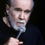 Picture of George Carlin with a microphone